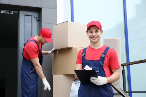 Specialist team handling piano removals in Catford with protective equipment