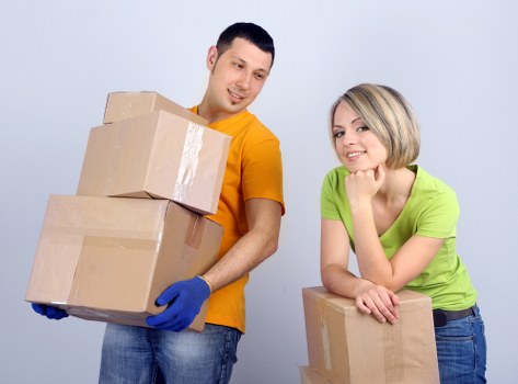 Careful moving crew protecting furniture during a relocation process
