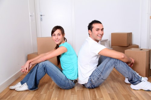 Trained movers handling furniture carefully during a relocation