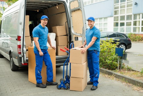 Local moving van loading furniture near Catford streets
