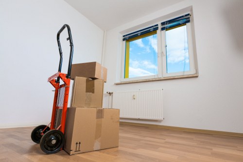 Professional movers planning a home move with organized packing materials