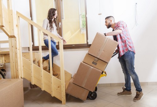 Careful loading of household items during a Catford flat relocation