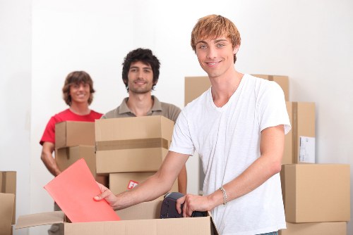 Preparing boxes and workstation items for an office move in Catford